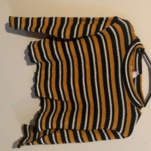 a thin knits sweater, gently used, a little stretchy. It is a cropped sweater